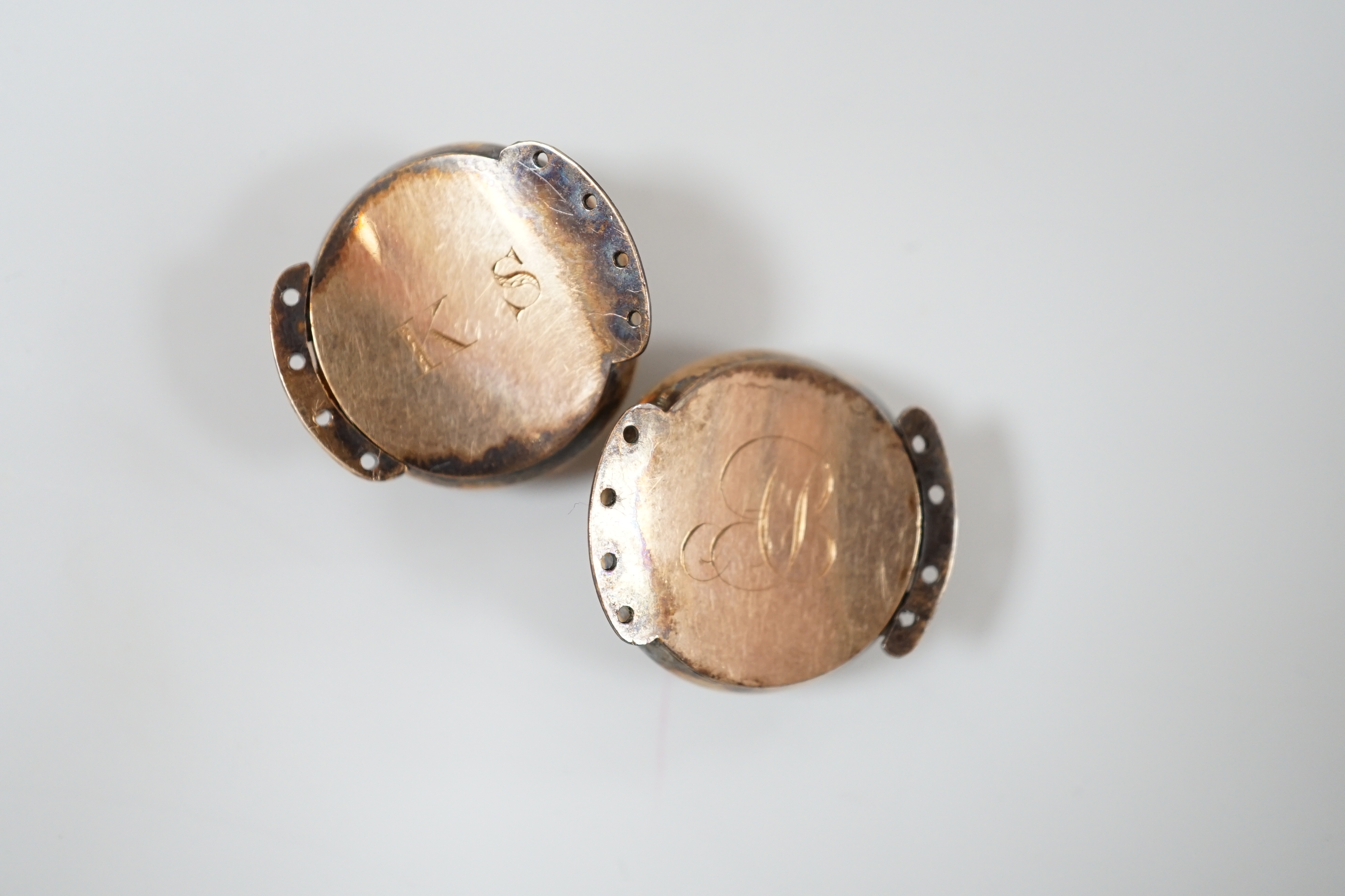 A pair of George III gold, enamel and pearl set clasps, each with differing hairwork inset and differing monogram / initials to the back, 2.25cm
